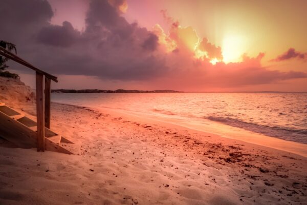Sunset over Grace Bay in Turks and Caicos, the kind of tropical beach setting that defined the 2026 Sports Illustrated Swimsuit cover shoots