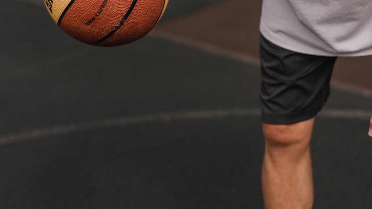NBA basketball playoff action shot player dribbling on court