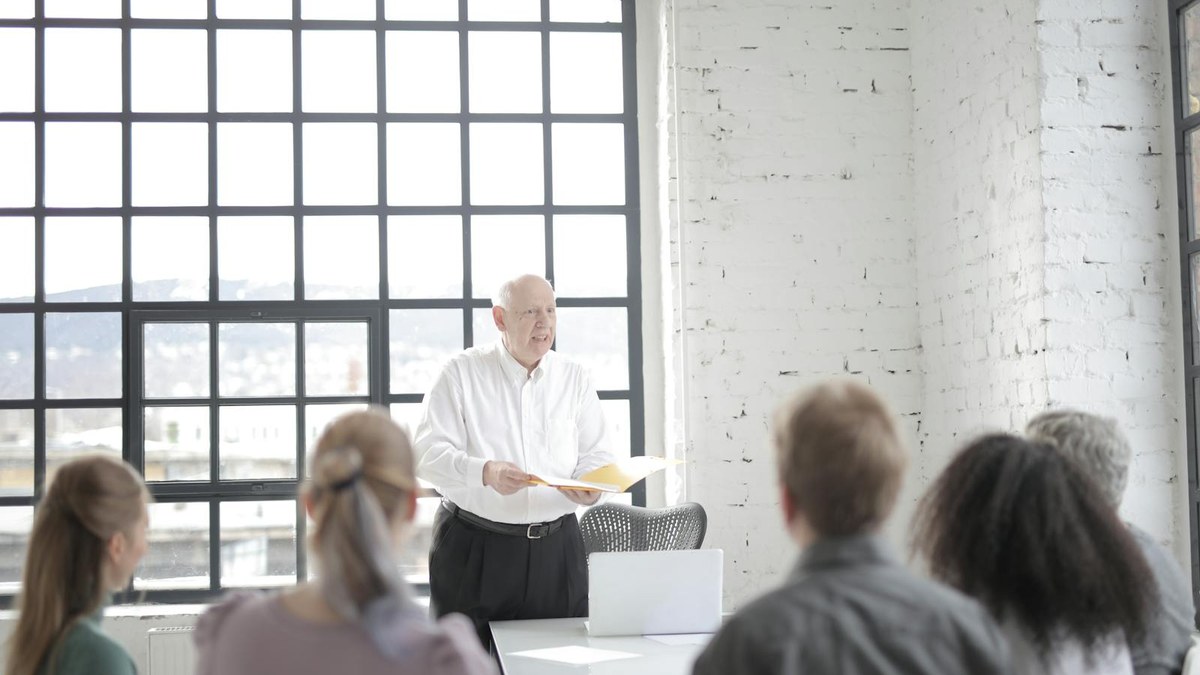 Modern boardroom with executives reviewing AI strategy on large screens