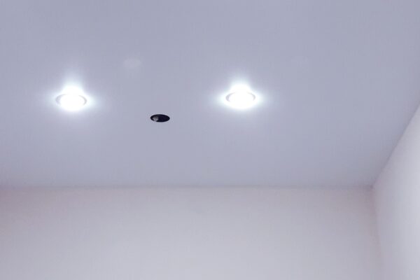 Smoke detector chirping on the ceiling, needing a battery replacement