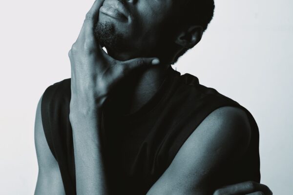 Person in deep thought reflecting on achievement and goals