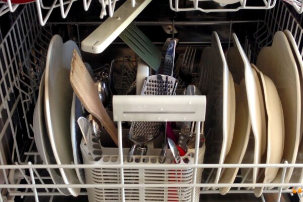 Dishwasher rack full of dishes that are not getting clean