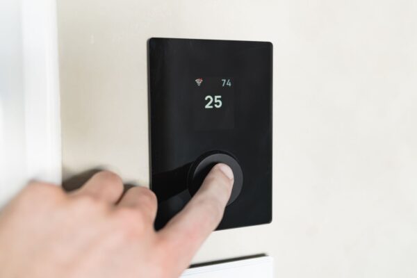 Modern digital thermostat on a wall not working and showing blank display