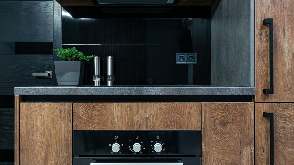 Modern kitchen counter with oven controls